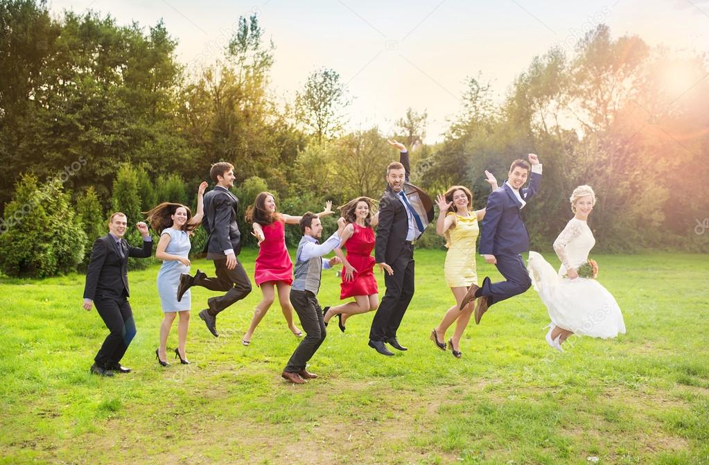 Bridesmaids and groomsmen jumping