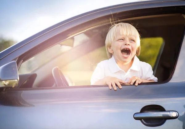 Little boy having fun time driving a car — Stock Photo, Image