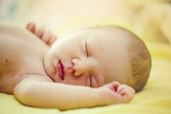 Sleeping baby on the bed — Stock Photo, Image