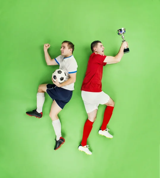 Jogadores de futebol comemorando vitória — Fotografia de Stock