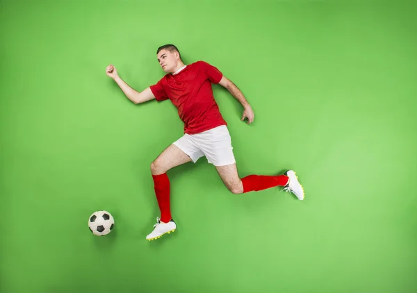 Jogador de futebol em ação — Fotografia de Stock