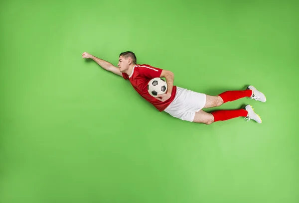 Giocatore di calcio in posa superman — Foto Stock