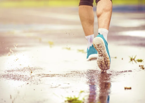 Man running in rainy weather — Stock Photo, Image