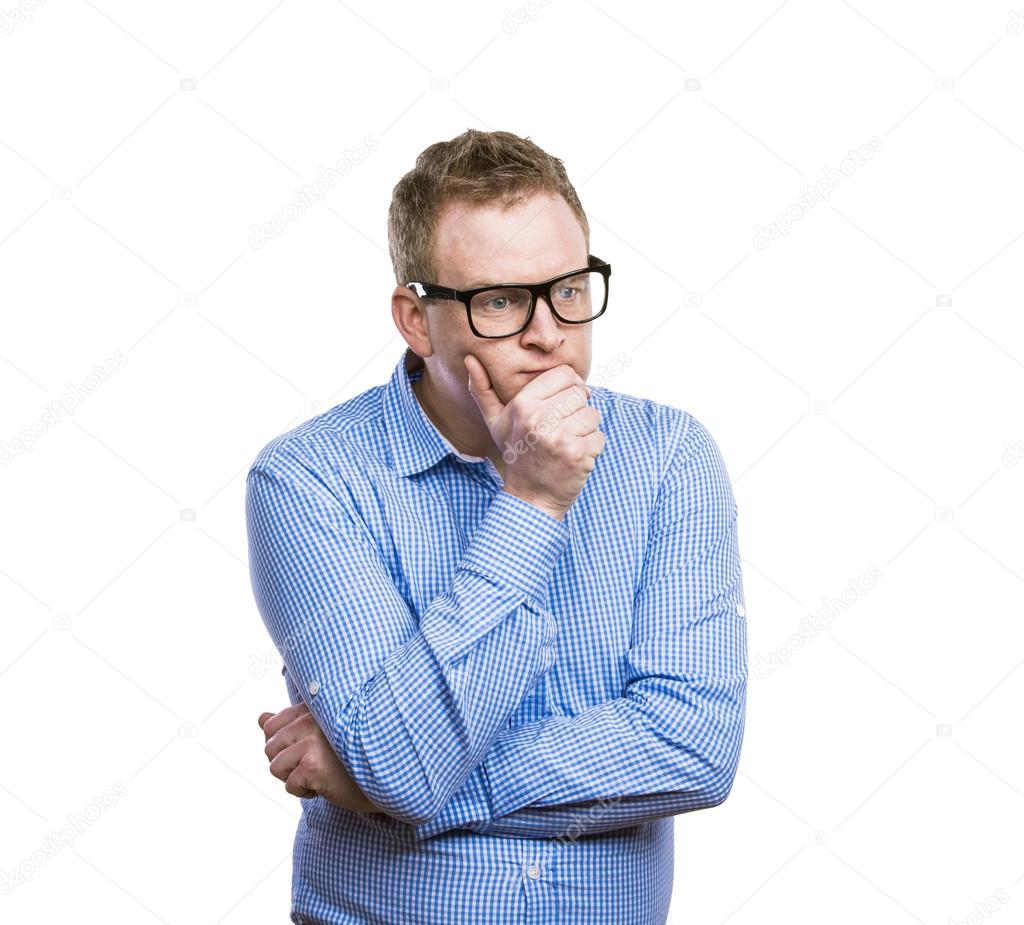 Man in glasses thinks about something