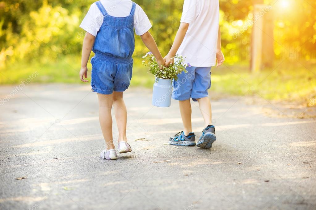 Little boy and girl taking a walk