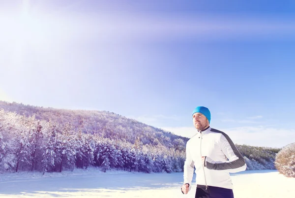 Sportovec, běhání v zimě — Stock fotografie
