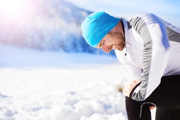 Sportsman injured knee during jogging — Stock Photo, Image