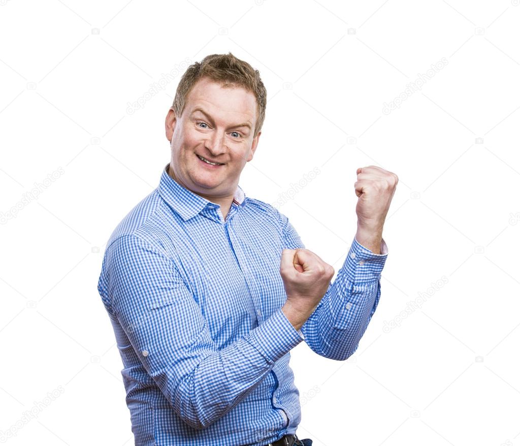 Man celebrating success with raised fists.