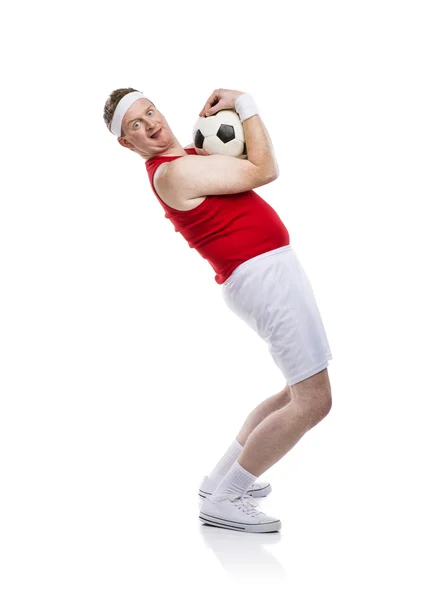 Jugador de fútbol divertido con una pelota — Foto de Stock