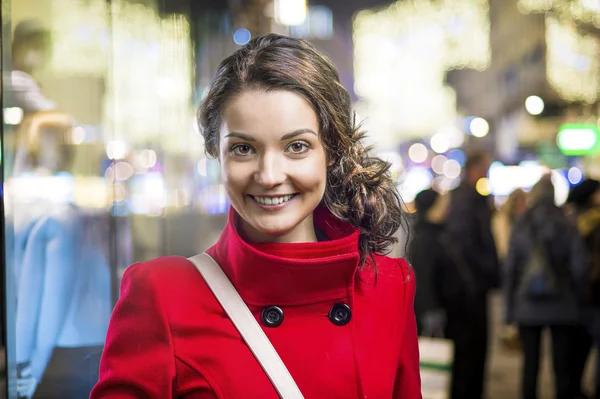 Beautiful woman in red coat — Stock Photo, Image