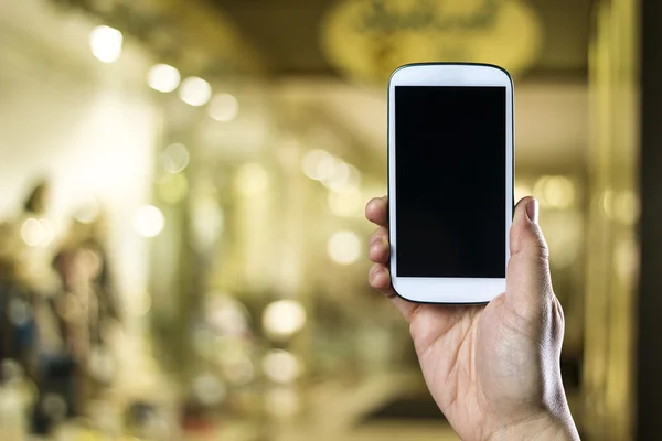 Man's hand holding his smart phone — Stock Photo, Image