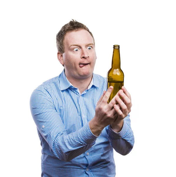 Drunk man holding a beer bottle — Stock Photo, Image