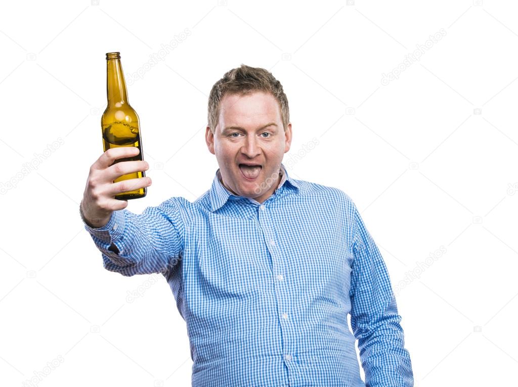 Drunk man holding a beer bottle