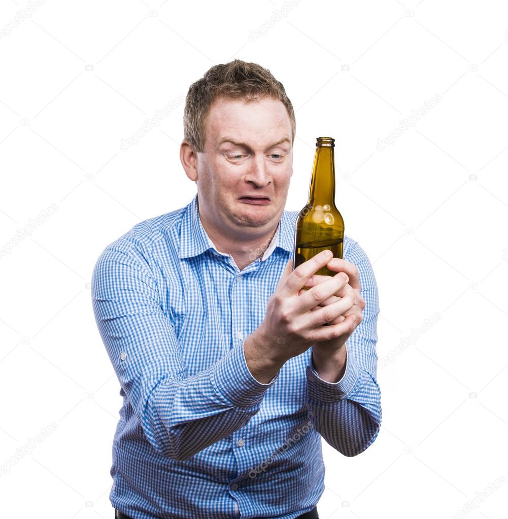 Drunk man holding a beer bottle