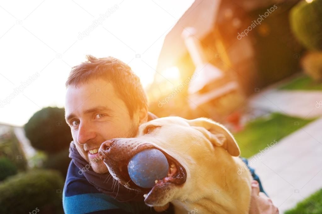 Man playing with his dog