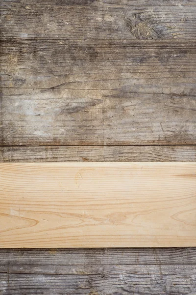 Board on wooden floor — Stock Photo, Image