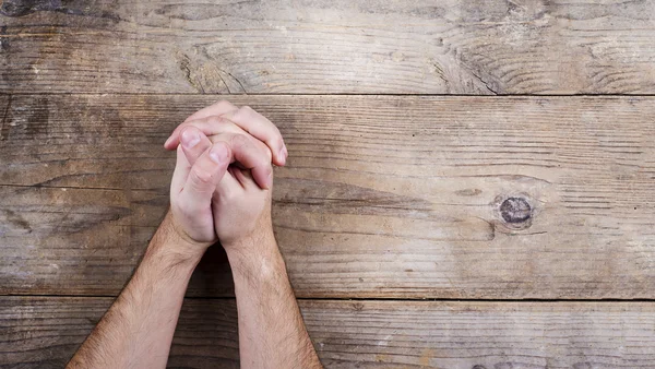 Hands of praying young man — Stock Photo, Image