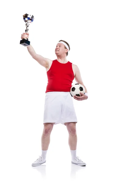 Спортсмен с трофеем и футбольным мячом . — стоковое фото