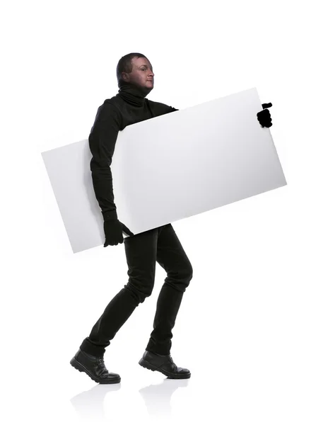 Thief with balaclava holding an empty banner — Stock Photo, Image