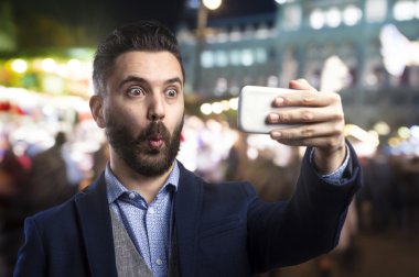 Hipster man taking selfie clipart