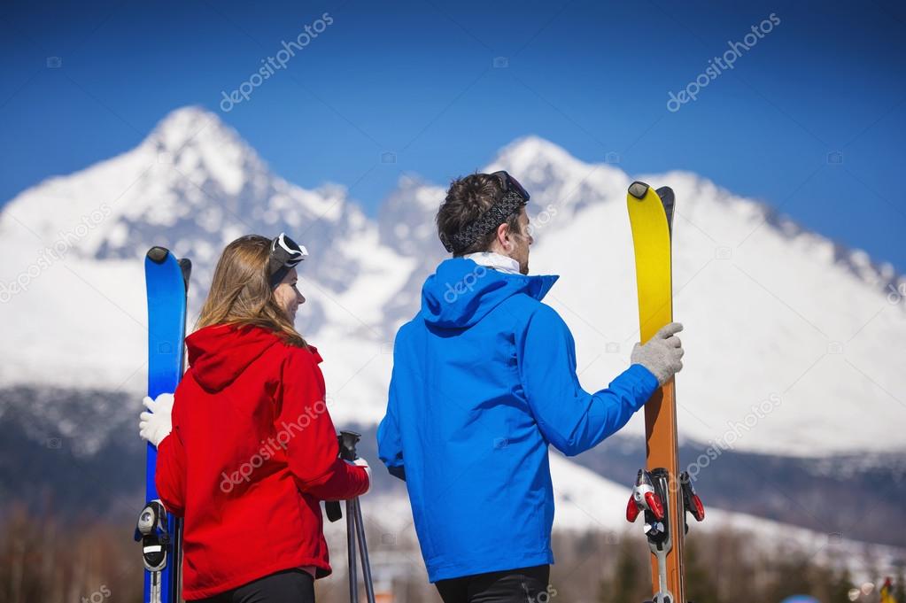 Couple skiing in winter nature
