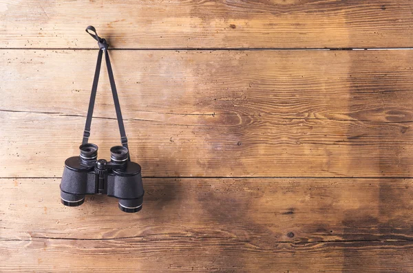 Binoculars hang on a fence — Stock Photo, Image