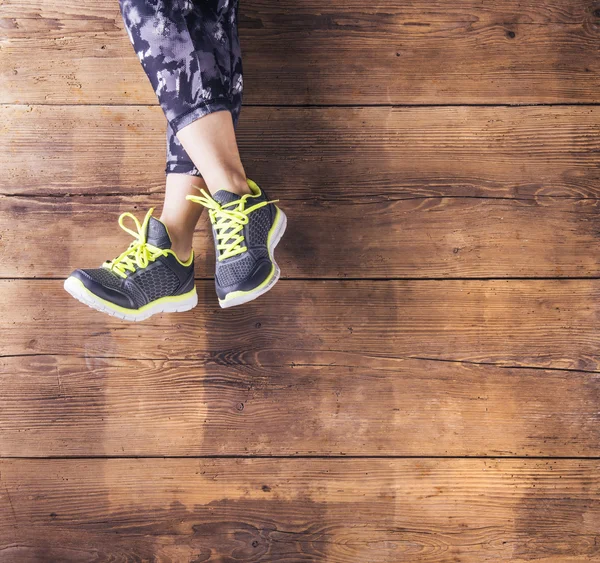 Runner sitting on a floor. — Stock Photo, Image