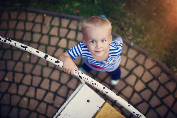 Menino no carrossel — Fotografia de Stock