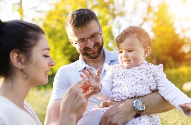 Happy family having fun in spring