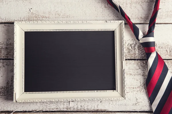 Foto frame en kleurrijke stropdas — Stockfoto