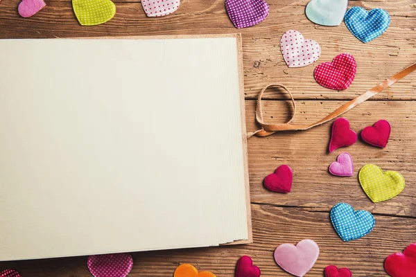 Fabric hearts and blank sheet of paper — Stock Photo, Image