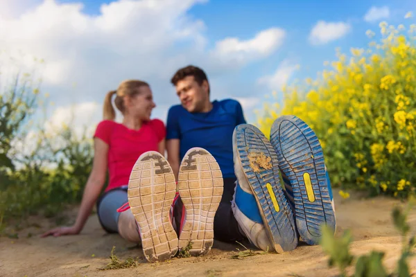 Young runners training in spring field — Stockfoto