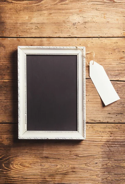White picture frame and empty tag — Stock fotografie
