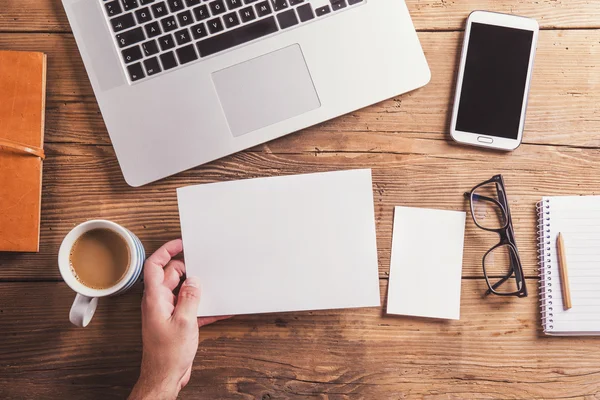 Office desk with blank sheet of paper. — Stock Photo, Image