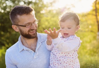 Happy father with his daughter having fun