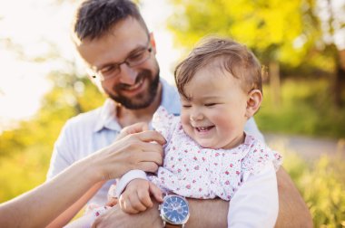 Happy father with his daughter having fun