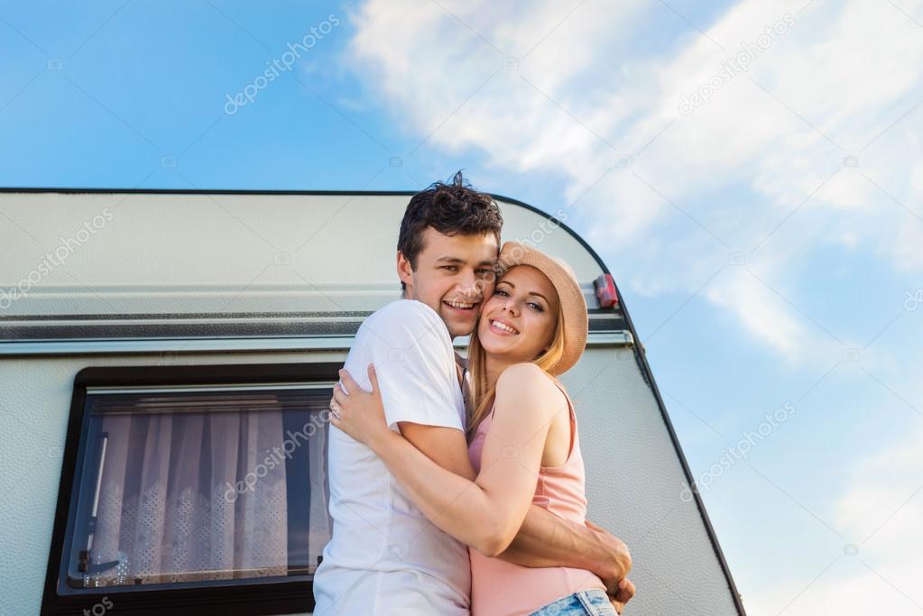 couple travelling with camper