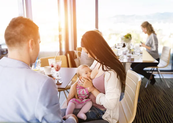 Mother breast feeding daughter — Stock Photo, Image