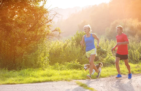 Senior couple running — Stock Photo, Image