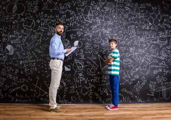 Young school teacher with pupil — Stock Photo, Image