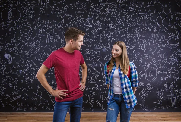 Two young, man and woman students — Stockfoto