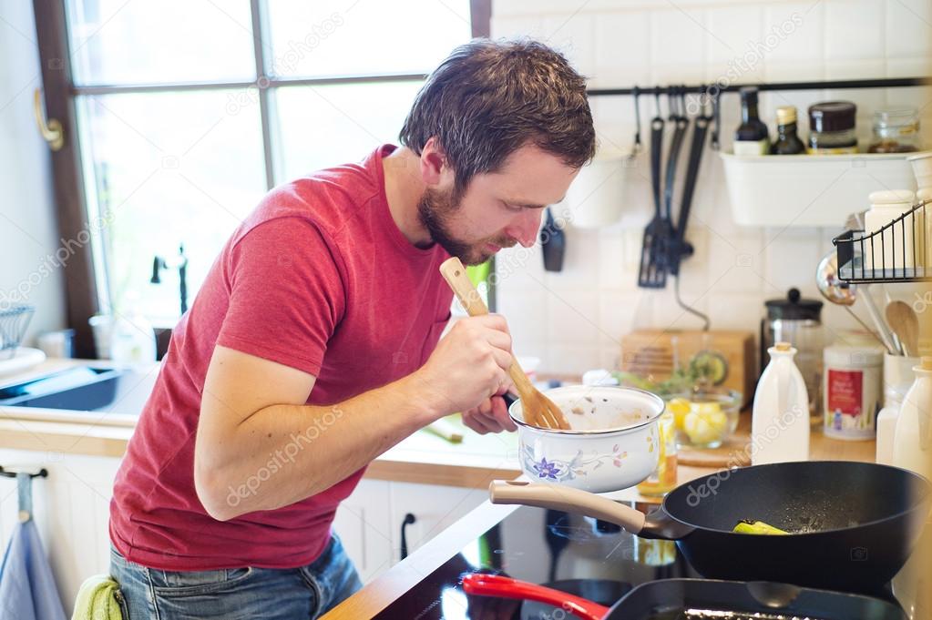 Man preparing creamy mushroom sauce