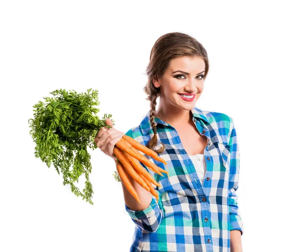 Mujer joven con zanahorias —  Fotos de Stock