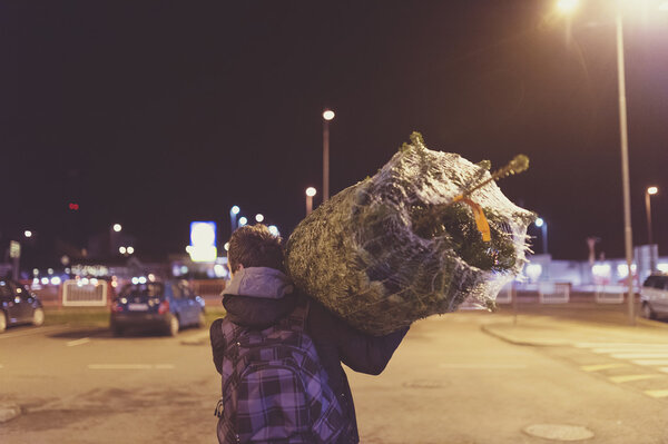 Man with christmas tree