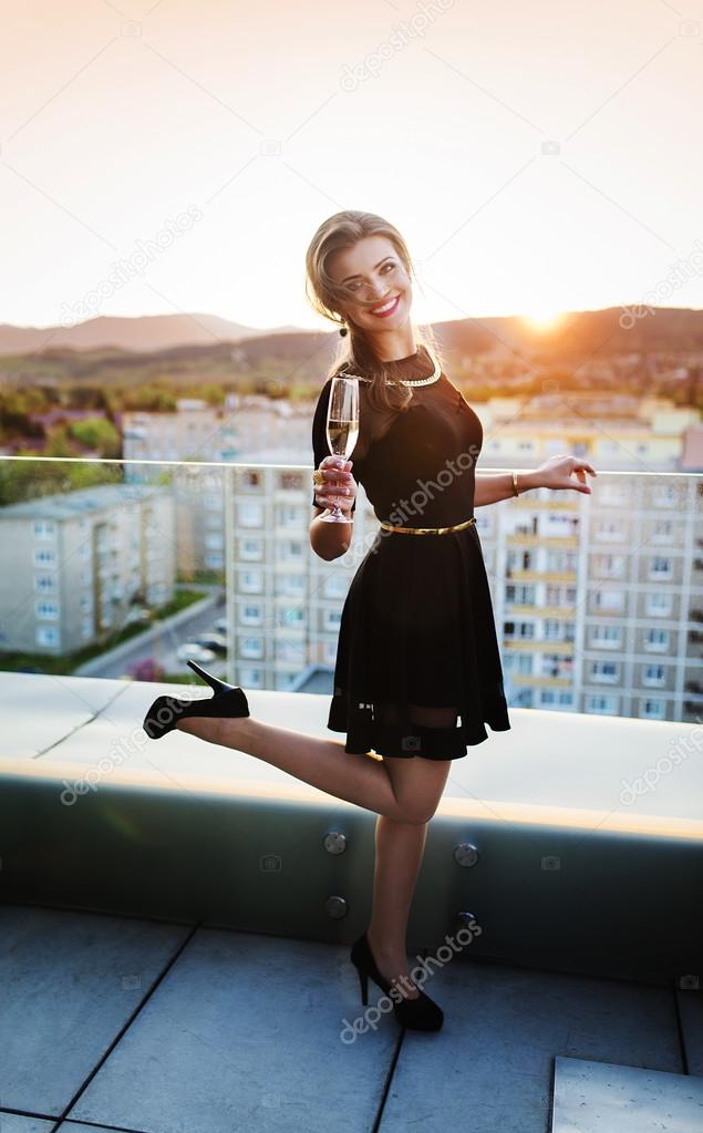 Beautiful woman drinking champagne