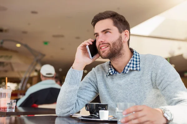 Handsome young man in cafe — Stock Photo, Image