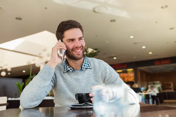 Handsome young man in cafe — Stock Photo, Image