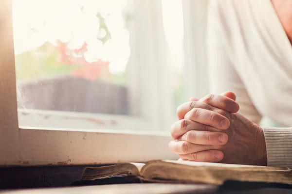 Woman praying with Bible — Stock Photo, Image