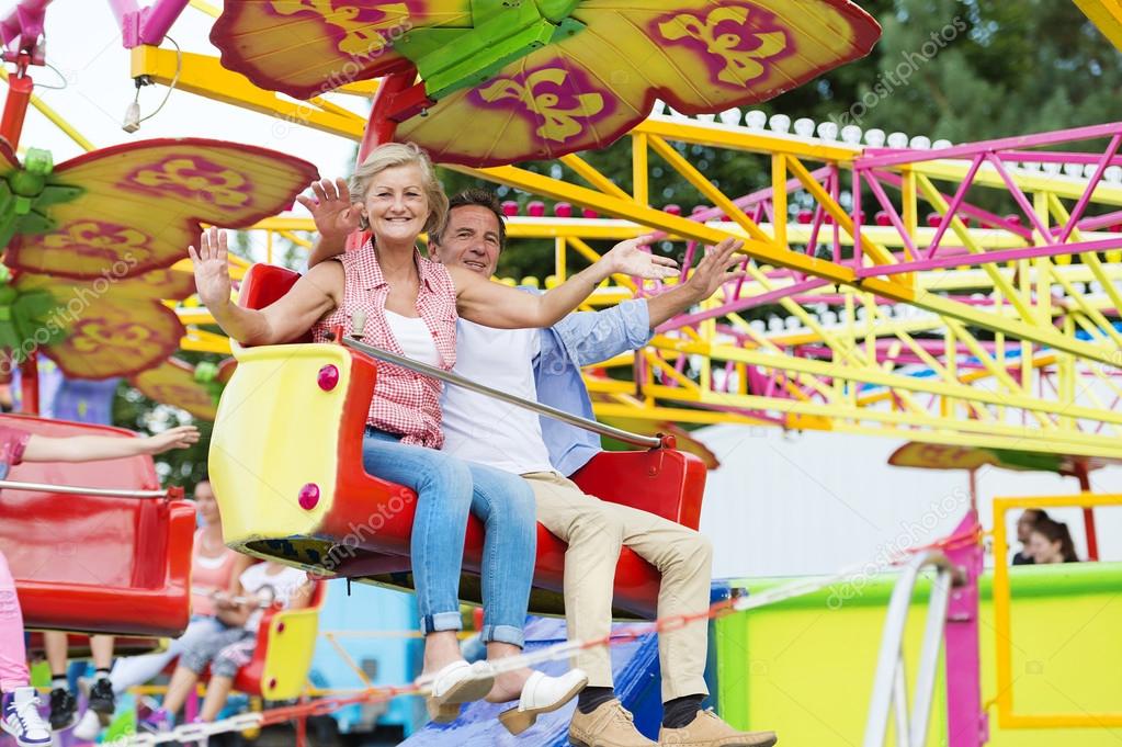 Senior couple in amusement park