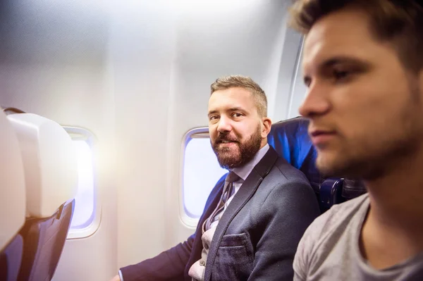 Men travelling by airplane — Stock Photo, Image